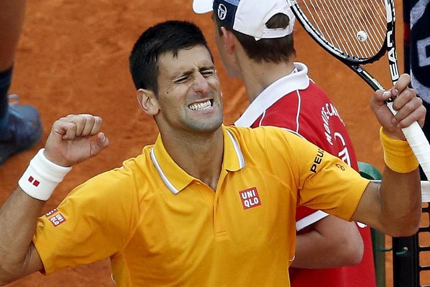 Novak Djokovic of Serbia reacts after defeating Tomas Berdych of the Czech Republic during their final tennis match at the Monte Carlo Masters in Monaco on April 19, 2015. -- PHOTO: REUTERS