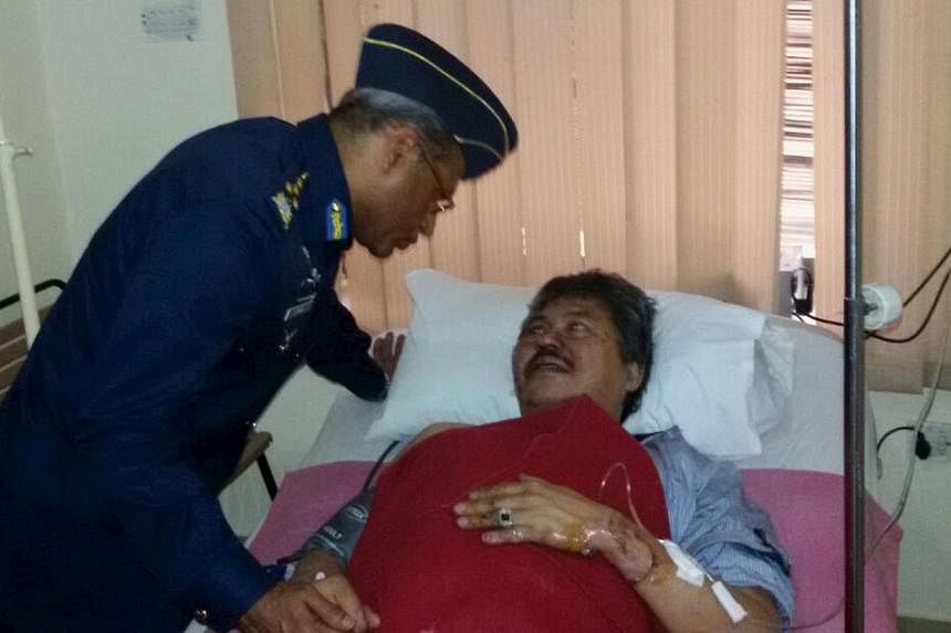 Air Chief Marshal Sohail Aman visits Malaysian Ambassador Hasrul Sani Mujtabar at the CMH hospital in Gilgit, Pakistan, in a handout picture received on May 8, 2015. Three ambassadors to Pakistan who survived a helicopter crash that killed seven peop
