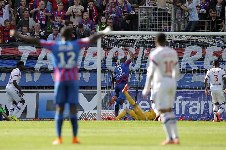 Caen's French forward Nicolas Benezet (unseen) scores the opening goal during the Ligue 1 match between Caen and Lyon on May 9, 2015. -- PHOTO: AFP&nbsp;