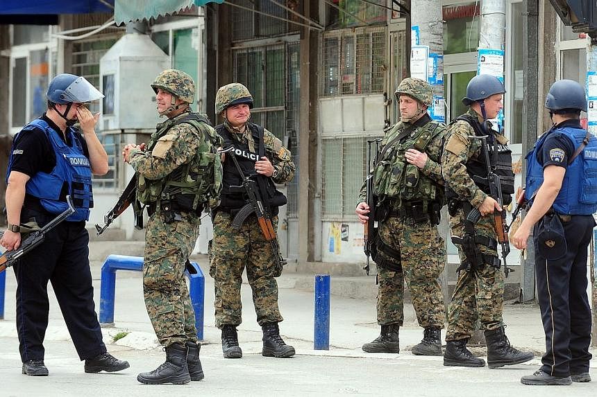 Macedonian police patrol in Kumanovo, north of the capital Skopje on May 9, 2015. &nbsp;Five police officers died and dozens were wounded in a daylong gun battle in an ethnic Albanian suburb of northern Macedonia on Saturday, adding the threat of arm