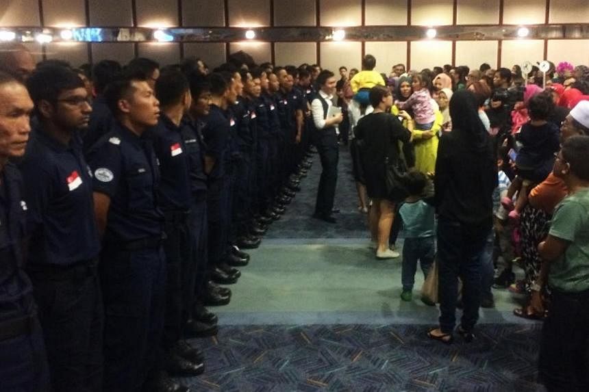 Family members welcome back 126 Home Team officers at Changi Airport Terminal 2 on Saturday. Some 126 Home Team officers returned home on Saturday evening to a rousing welcome after spending two weeks carrying out rescue operations in earthquake-hit 