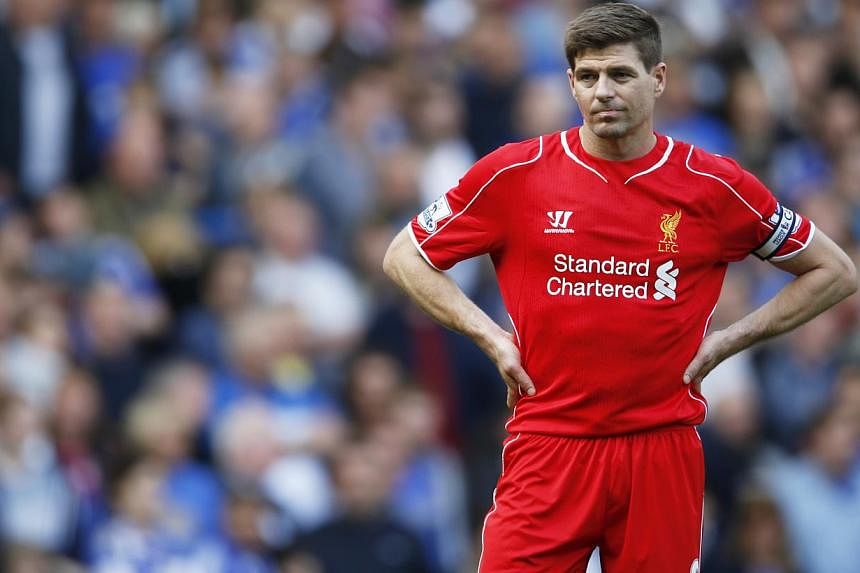Liverpool's captain Steven Gerrard looks dejected as hopes of Champions League qualification for Liverpool were all but ended on Sunday when they drew 1-1 at newly crowned Premier League champions Chelsea in a langourous end-of-season encounter. -- P