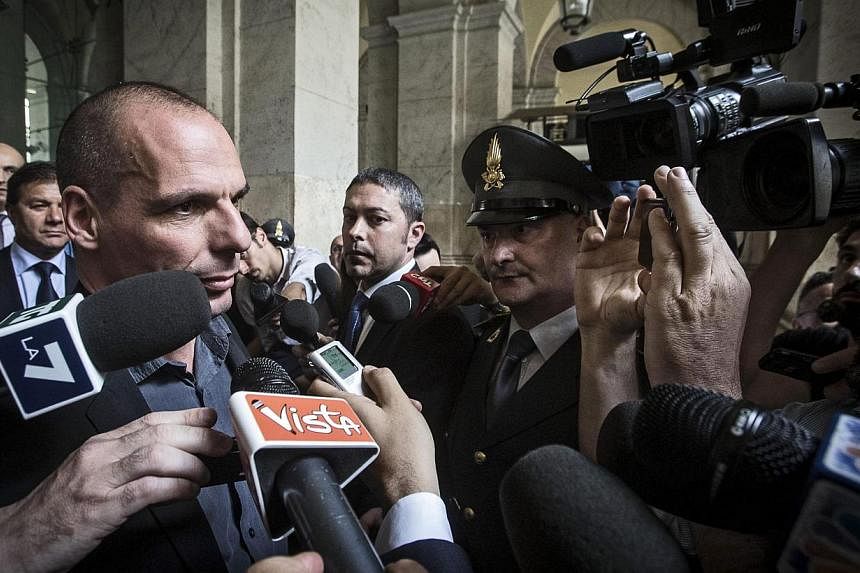 Greek Finance Minister Yanis Varoufakis (left) leaving after meeting his Italian counterpart Padoan in Rome, Italy, on May 6, 2015 in preparation for a Eurozone finance ministers meeting scheduled for May 11, 2015. -- PHOTO EPA
