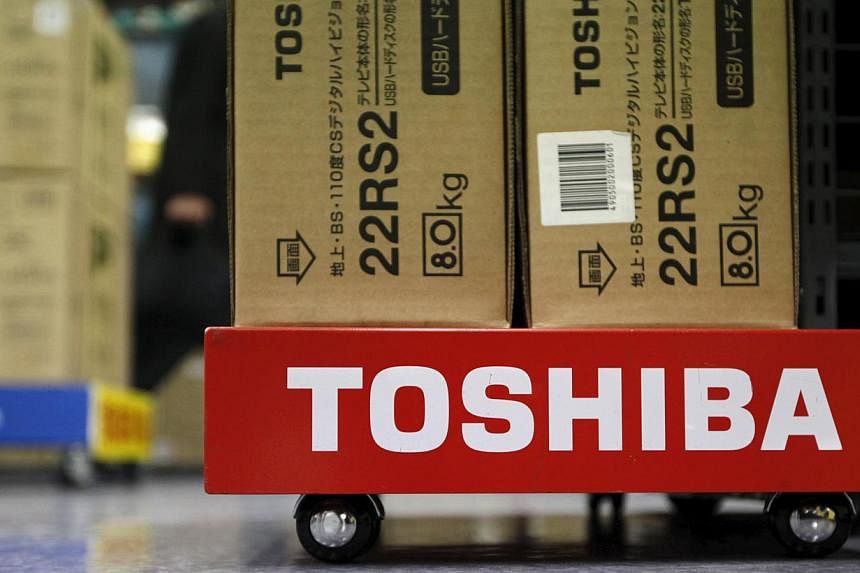 Toshiba shares plunged more than 16 per cent Monday after the Japanese conglomerate withdrew its earnings forecast and said it won't pay a dividend, citing a probe into accounting irregularities on infrastructure projects. -- PHOTO: REUTERS