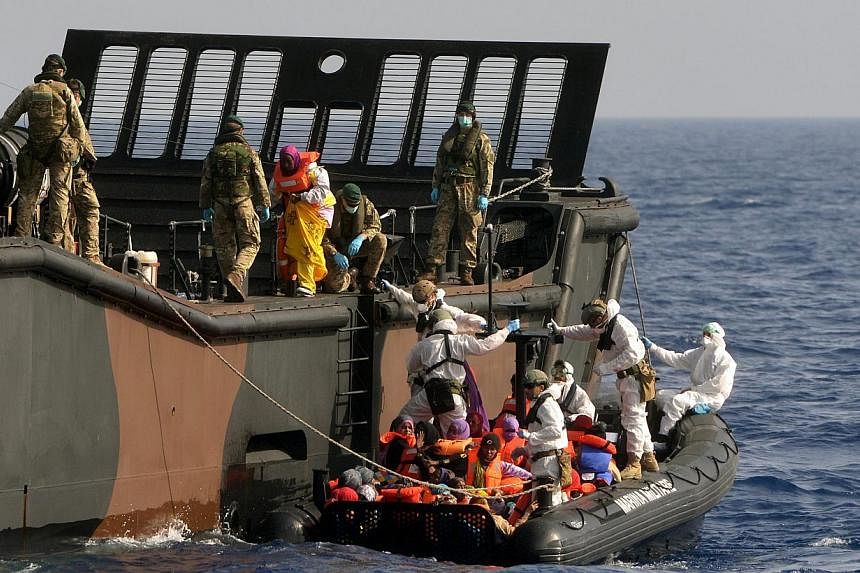 British Royal Navy personnel from HMS Bulwark helping rescued individuals onto a Royal Navy Landing Craft, in the Mediterranean Sea. Europe's first priority in confronting the Mediterranean migrant crisis is to save lives, EU foreign policy chief Fed