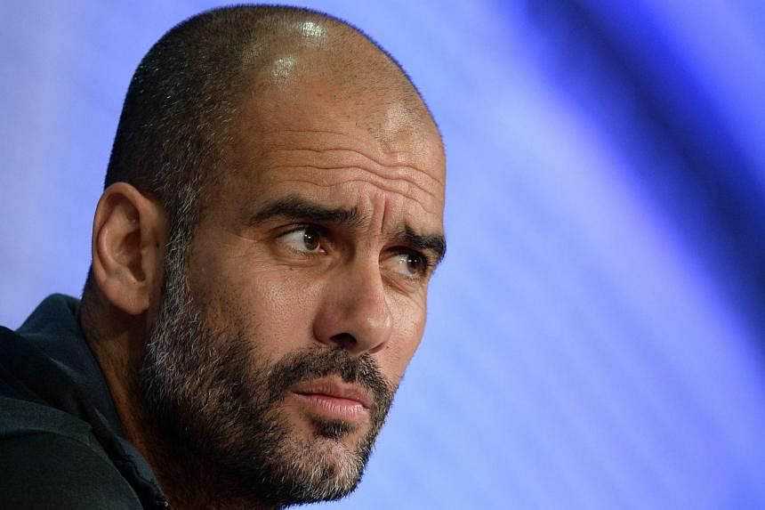 Bayern Munich's Spanish headcoach Pep Guardiola. He has dismissed out of hand rumours he will be quitting Bayern Munich with a year left on his contract to become Manchester City coach next season. -- PHOTO: AFP