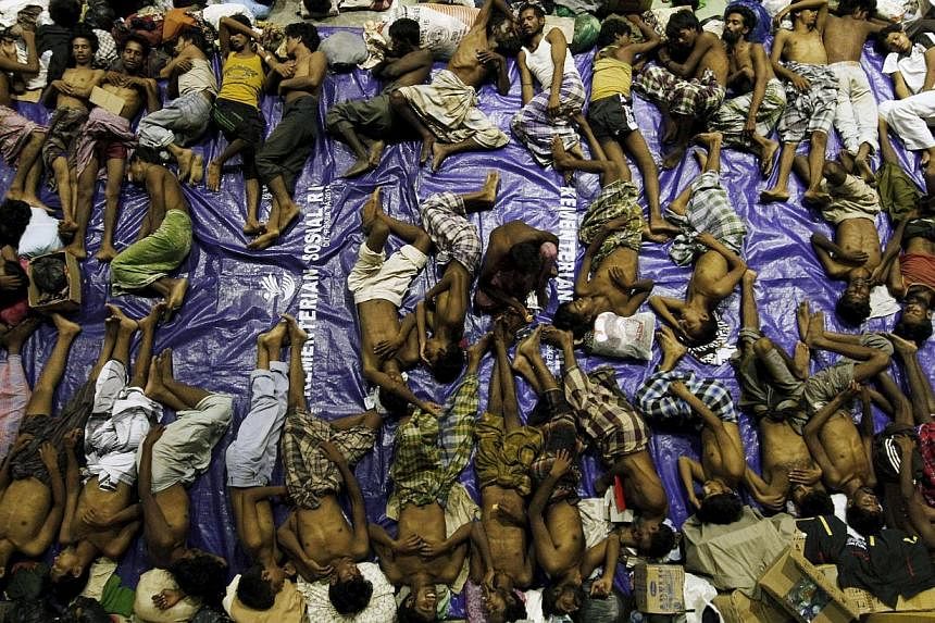 Four boats carrying some 1,400 Rohingya migrants were rescued off the coasts of Indonesia and Malaysia on Monday, officials said, a day after nearly 600 others arrived in a wooden vessel off Indonesia’s Aceh.&nbsp;-- PHOTO: REUTERS