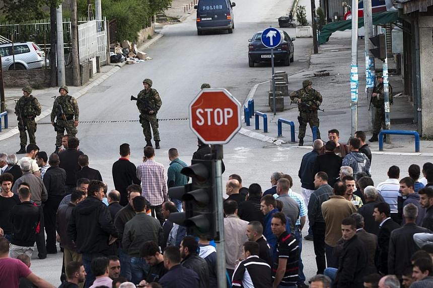 Police officers secure a street in Kumanovo, the Former Yugoslav Republic of Macedonia, on May 10, 2015, after at least 22 people were killed in clashes.&nbsp;UN Secretary-General Ban Ki Moon on Monday called for calm to return to Macedonia after vio