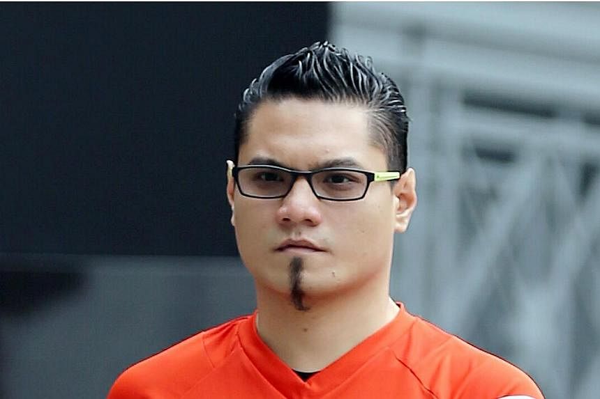 Train driver Muhamad Nizam Ahmad, 31, faced 16 charges in court and pleaded guilty to six of them. He had trespassed into other people's homes to molest women and commit theft. -- ST PHOTO: WONG KWAI CHOW
