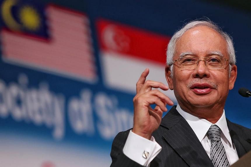Malaysian Prime Minister Najib Razak told staff at his department's monthly assembly in Putrajaya on May 11, 2015, that a government must not be afraid to make unpopular decisions if it benefits the country in the long run. -- PHOTO: LIANHE ZAOBAO