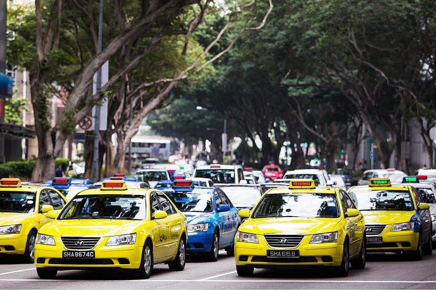 The Government this week stepped in to regulate the growing sector of third-party taxi booking services, promising to safeguard the interest of commuters while also allowing space for the nascent industry to innovate and expand. -- PHOTO: BLOOMBERG&n