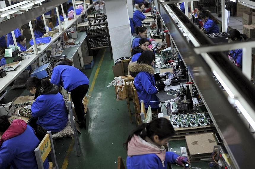 China's industrial output growth ticked higher in April while investment slowed to the weakest pace in more than 14 years, suggesting monetary easing is trickling through the economy while more may be needed to spur a pick up. -- PHOTO: REUTERS
