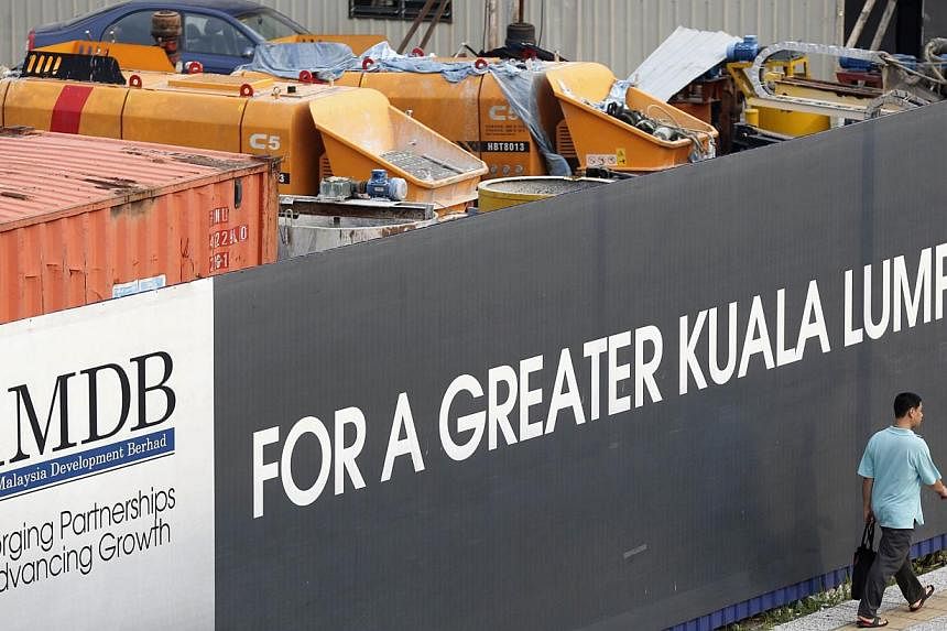 1Malaysia Development may make an early repayment of a US$975 million syndicated loan led by Deutsche Bank that the state investment company took out in September, according to people familiar with the matter. -- PHOTO: REUTERS