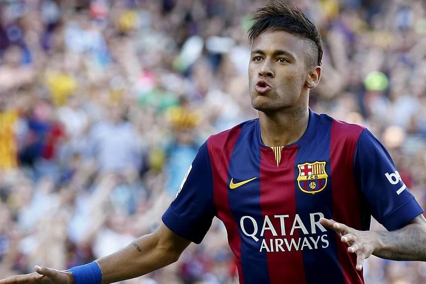 A Spanish judge on Wednesday ordered Barcelona football club to stand trial over alleged tax fraud linked to the signing of Brazilian striker Neymar. -- PHOTO: REUTERS