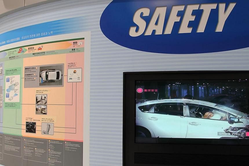 A screen displaying a video on airbag safety on Toyota vehicles at the company's showroom in Tokyo in 2013. Toyota and rival Nissan on Wednesday announced the recall of about 6.5 million vehicles globally in the latest chapter of an exploding airbag 