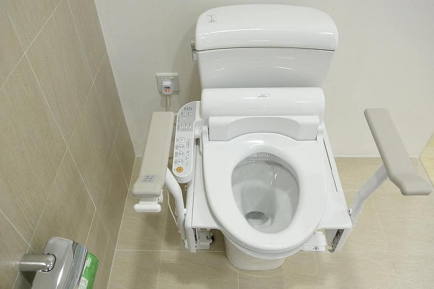 Japan is readying to lift the lid on what could be its most effective global marketing gimmick yet: the high-tech toilet seat. -- PHOTO: ST FILE