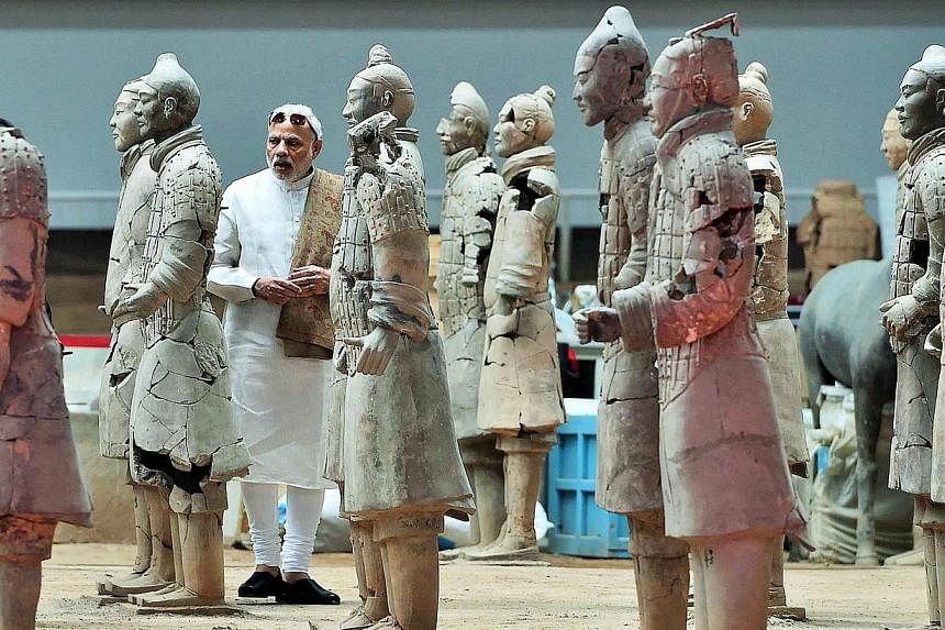 In this handout photograph taken and released by the Indian Press Information Bureau (PIB) on May 14, 2015, India's Prime Minister Narendra Modi looks on as he visits the Terracotta Warriors museum in Xian. -- PHOTO: AFP/PIB&nbsp;