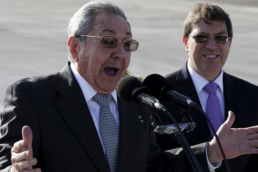 Cuba's president Raul Castro (left) speaking next to Foreign Minister Bruno Rodriguez at Jose Marti airport in Havana on May 12, 2015. The US and Cuba will hold a new meeting in coming weeks in Washington on reopening embassies, the latest step in th