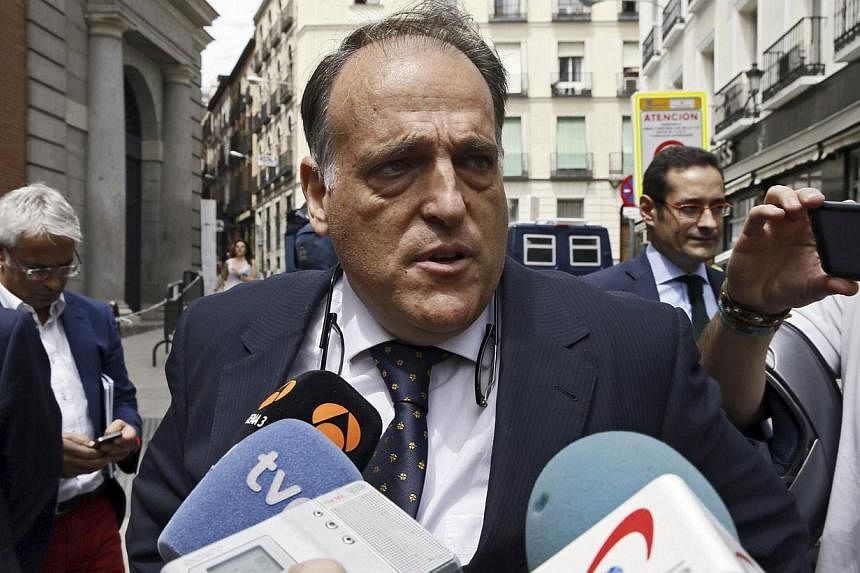 President of Spanish Professional Football League (LFP), Javier Tebas, addresses the media as he arrives to the Parliament's Lower Chamber to attend the voting of the government decree ruling the central sale of television rights of the league matche