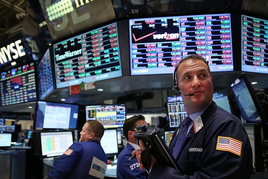 Traders working on the floor of the New York Stock Exchange (NYSE) on May 5, 2015. -- PHOTO: AFP