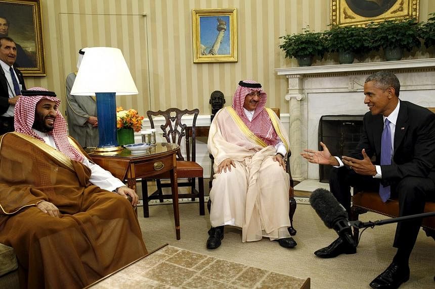 US President Barack Obama meets with Crown Prince Mohammed bin Nayef (centre) and Deputy Crown Prince Mohammed bin Salman (left) of Saudi Arabia in the Oval Office of the White House in Washington May 13, 2015. -- PHOTO: REUTERS