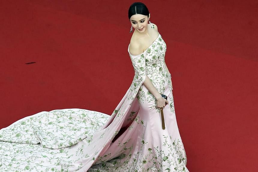 Chinese actress Fan Bingbing poses as she arrives for the opening ceremony of the 68th Cannes Film Festival in Cannes, south-eastern France on May 13, 2015. -- PHOTO: AFP