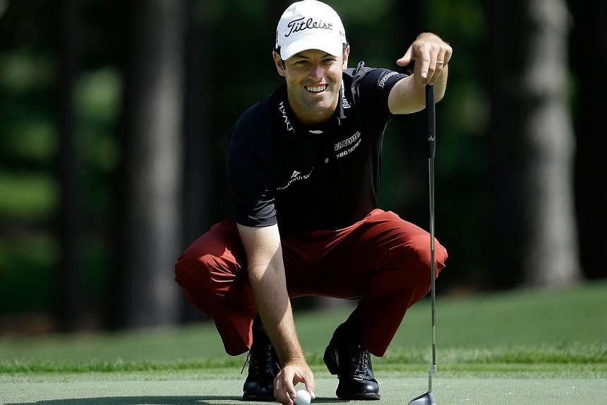 Robert Streb lining up a putt on the first hole during round one at the Wells Fargo Championship at Quail Hollow Club on May 14, 2015. -- PHOTO: AFP