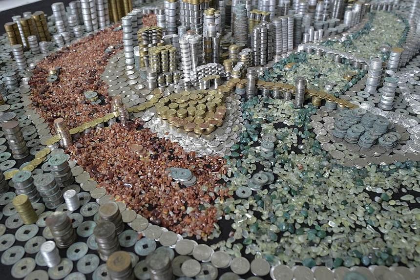 The replica of Chongqing City built with coins and agate stones. -- PHOTO: AFP&nbsp;