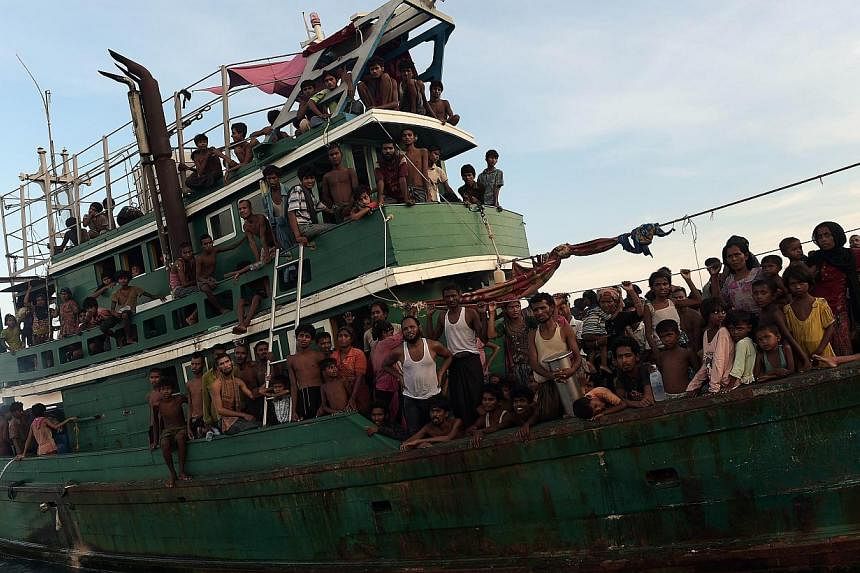 Rohingya migrants on a boat drifting in Thai waters off the southern island of Koh Lipe in the Andaman sea on May 14, 2015. -- PHOTO: AFP