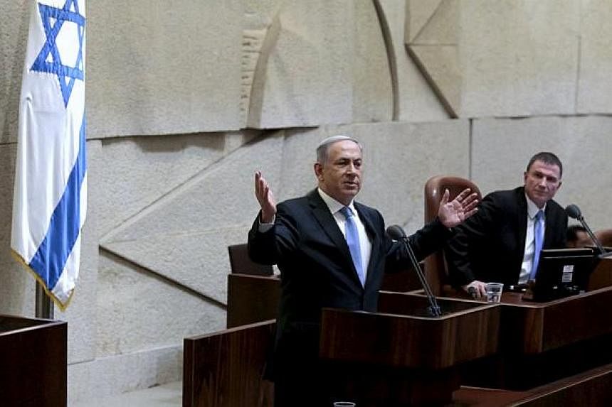Israeli Prime Minister Benjamin Netanyahu delivers a speech in the Knesset, the Israeli parliament, before his new government is sworn in following the mid-March general elections, in Jerusalem May 14, 2015. -- PHOTO: REUTERS