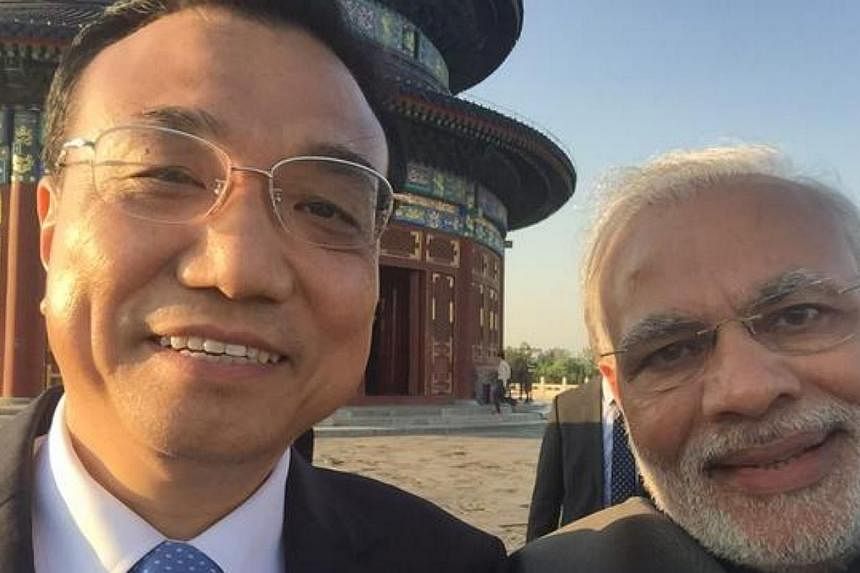 Chinese Premier Li Keqiang appeared in a grinning selfie with visiting Indian Prime Minister Narendra Modi on Friday. -- PHOTO: NARENDRA MODI/TWITTER&nbsp;