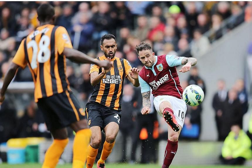 Danny Ings (right) of Burnley in action with Ahmed Elmohamady of Hull City. Hull City lost 1-0.. -- PHOTO: REUTERS