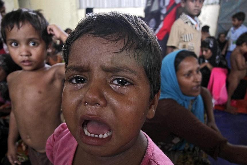 A child at a refugee camp at Kuala Langsa, Aceh, Indonesia, on May 15, 2015. -- PHOTO: EPA