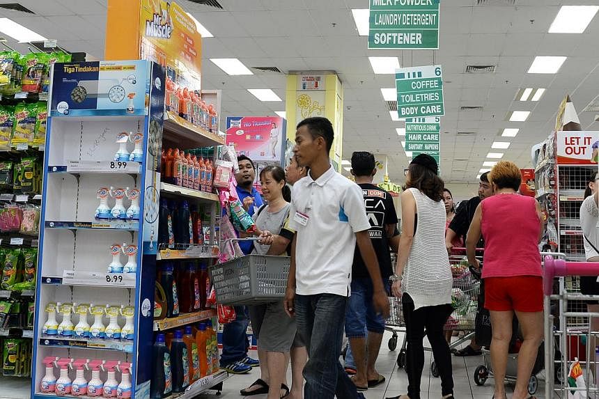 Shoppers at the Aeon Bukit Indah Shopping Centre in Johor Bahru on March 31, 2015, a day before the Goods and Services Tax kicked in on April 1. Malaysia's economy grew 5.6 per cent in the first quarter of the year, faster than expected largely due t