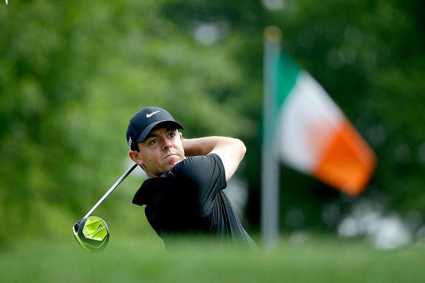 Rory McIlroy of Northern Ireland tees off on the first hole during round two at the Wells Fargo Championship at Quail Hollow Club on May 15, 2015, in Charlotte, North Carolina. -- PHOTO: AFP
