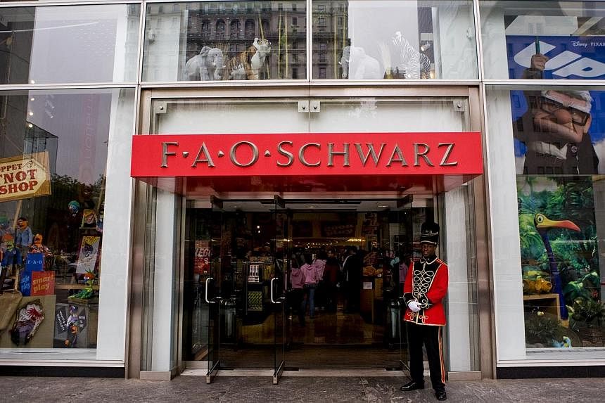 A doorman dressed as a toy soldier standing outside the FAO Schwarz flagship store on Fifth Avenue in New York, US. -- PHOTO: BLOOMBERG NEWS