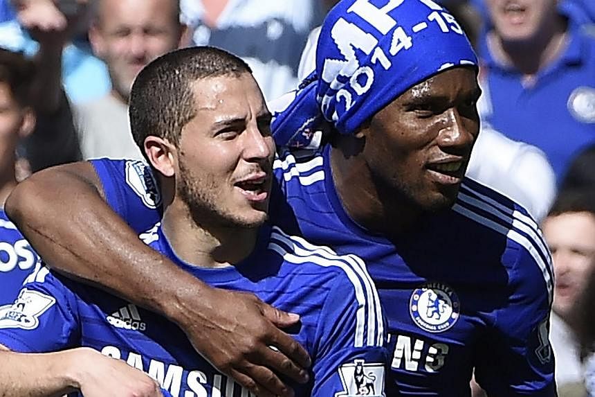 Chelsea's Eden Hazard (left) and Didier Drogba (right) celebrate after a match against Crystal Palace at Stamford Bridge, London, Britain, May 3, 2015. -- PHOTO: EPA