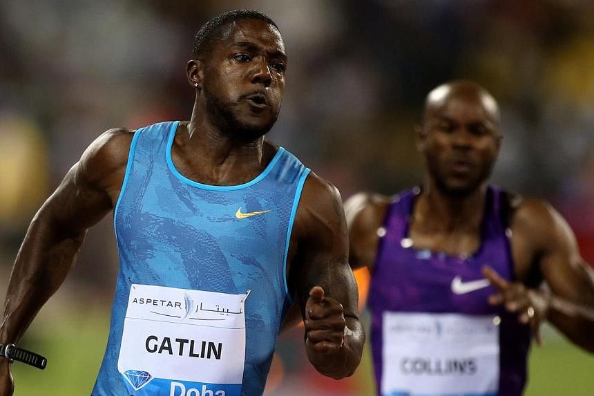 Justin Gatlin (left) of the United States sprints to win the 100m men's race at the Diamond League athletics meeting at the Suhaim bin Hamad Stadium in Doha on May 15, 2015. Gatlin set a world best time for 2015 at a Diamond meeting when he stormed t
