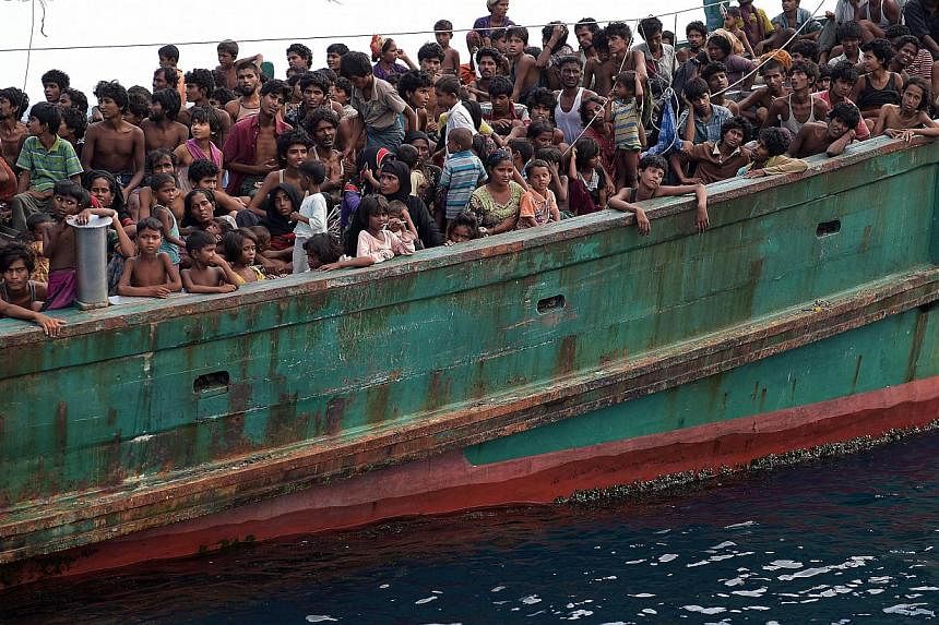 Rohingya migrants on a boat drifting in Thai waters off the southern island of Koh Lipe in the Andaman on May 14, 2015. -- PHOTO: AFP
