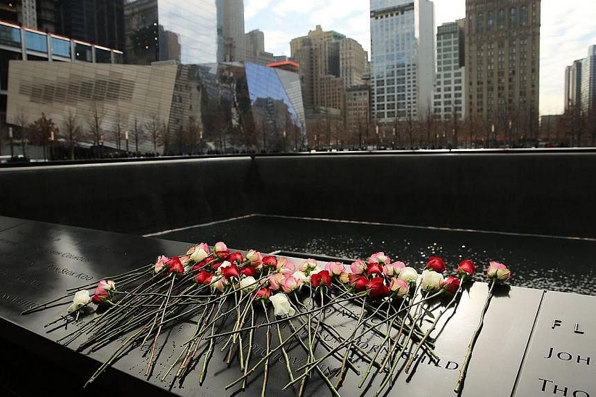 Flowers are viewed at one of the reflecting pools at Ground Zero with the names of those killed in the 1993 World Trade Center bombing that killed six people and injured more than 1,000, on February 26, 2015 in New York City. About 2.7 million people