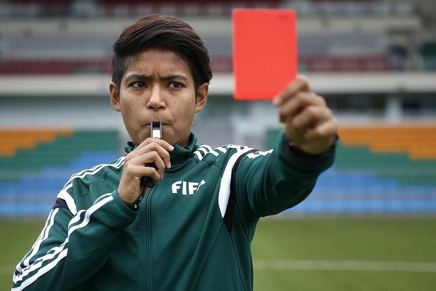 Singaporean football referee Abirami Naidu will complete a unique treble when she takes up the whistle at next month's Women's World Cup in Canada, having already officiated in the Women's World Cup at the Under-17 level in Costa Rica last year and t