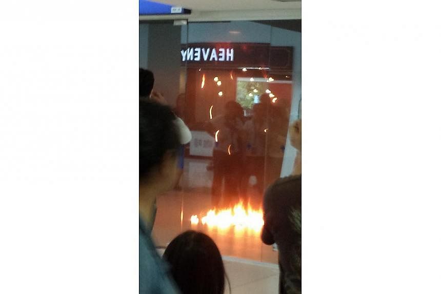 A POSB branch in Rivervale Plaza in Sengkang caught fire on Sunday afternoon.&nbsp;-- PHOTO: STOMP
