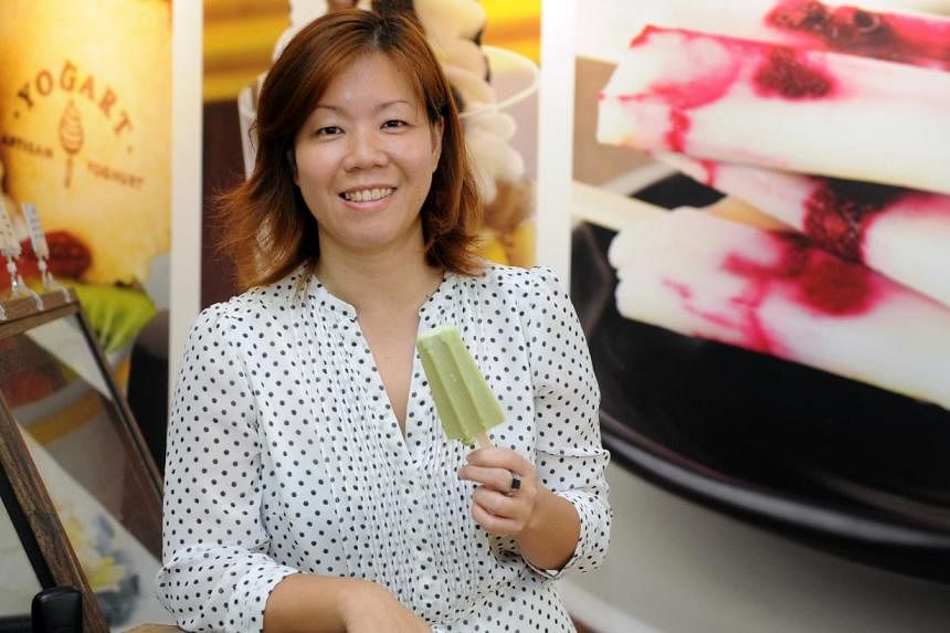 Yogart co-owner Lee Hwai Chi with the Holy Molli, a popsicle made from avocado and lime-flavoured frozen yogurt. -- ST PHOTO: TIFFANY GOH