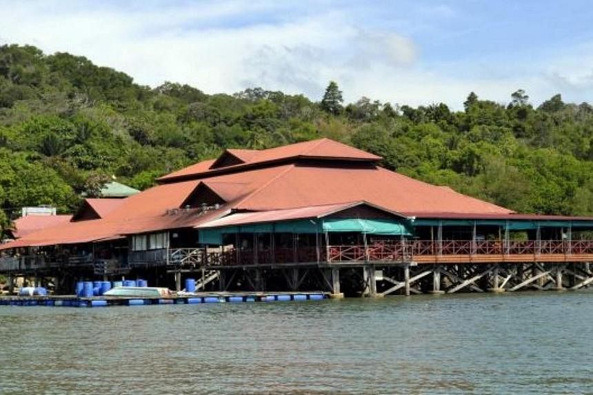 Gunmen believed to be holding two Malaysians, who were kidnapped from the Ocean King seafood restaurant (pictured) just outside&nbsp;Sandakan town in Sabah,&nbsp;have contacted the victims' families with demands for a "large" ransom, said police. -- 