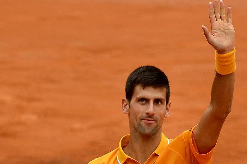 Novak Djokovic of Serbia celebrates after winning against David Ferrer of Spain on May 16, 2015 in Rome. -- PHOTO: AFP