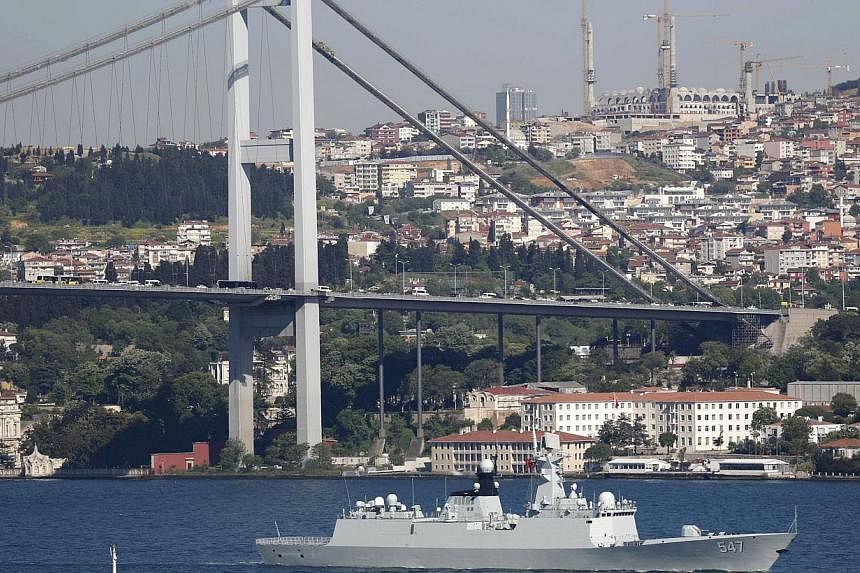 Chinese People's Liberation Army (PLA) navy frigate Linyi sets sail in the Bosphorus, on its way to the Mediterranean Sea, in Istanbul, Turkey on May 14, 2015. Nine Russian and Chinese navy vessels gathered in the Mediterranean Sea for joint military