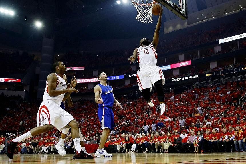 James Harden #13 of the Houston Rockets shoots against the Los Angeles Clippers in the first quarter during Game Seven of the Western Conference Semifinals at the Toyota Center in Houston on May 17, 2015. -- PHOTO: AFP