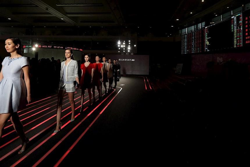 Models presenting creations from Ellassay, a women's apparel company, at the Shanghai Stock Exchange following its IPO last month. The Chinese city's booming exchange boasted 35 IPOs that raised about US$5.4 billion (S$7 billion) in the first quarter