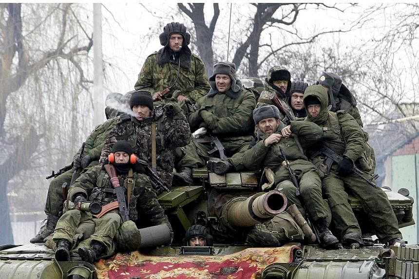 Members of the armed forces of the separatist self-proclaimed Donetsk People's Republic drive a tank on the outskirts of Donetsk, Ukraine, in this Jan 22, 2015 file photo.&nbsp;The Kremlin reiterated on Monday, May 18, that there were no regular Russ