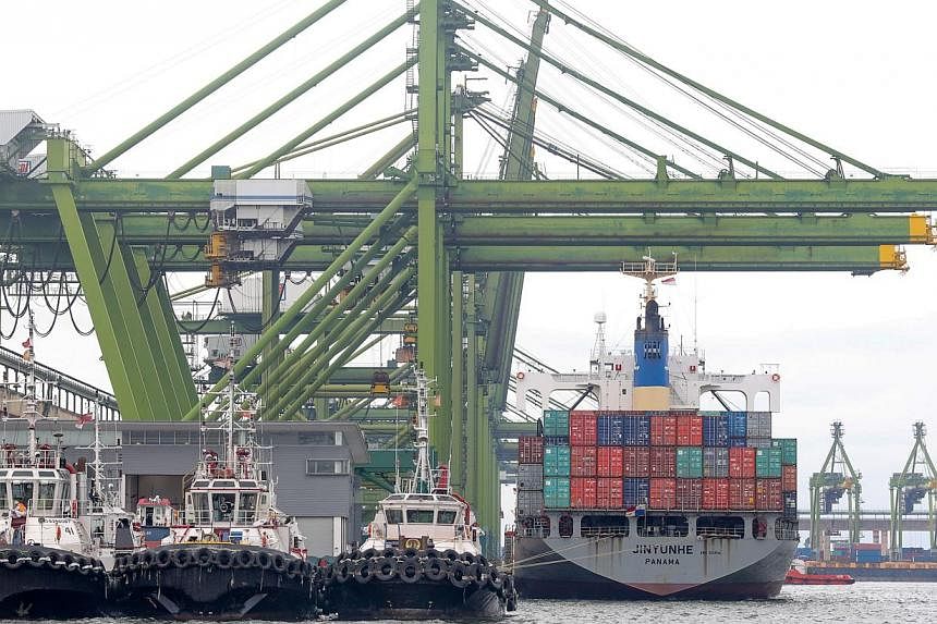 A container ship berthed at the Port of Singapore Authority's (PSA) Pasir Panjang Terminal. According to a Reuters poll, Singapore's non-oil domestic exports (NODX) are forecast to have fallen in April. -- PHOTO: ST FILE&nbsp;